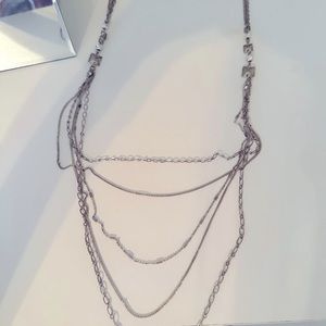 Long layered silver necklace. Unsure of where it was purchased.